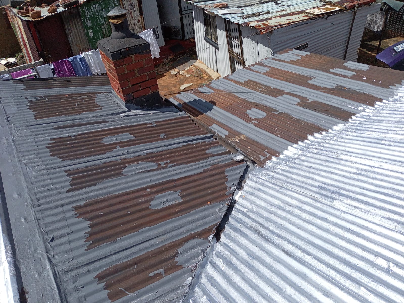 Residential roof waterproofing membrane coating under construction
